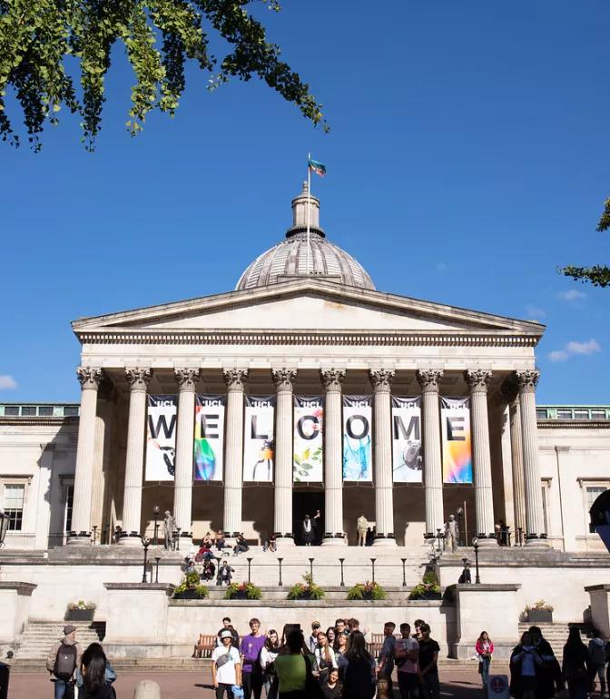 The portico of University College London's main building, hung with welcome banners